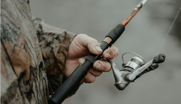 Man holding a fishing rod.